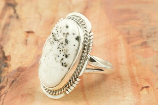 White Buffalo Turquoise set in Sterling Silver Ring. This Beautiful Stone is formed from the minerals Calcite and Iron. It is mined near Tonopah Nevada. Created by Navajo Artist Margaret Platero. Signed by the Artist.